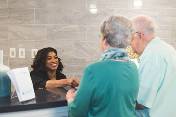 Residents interacting with a receptionist