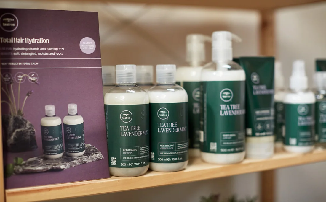 Paul Mitchell Tea Tree products displayed in a salon
